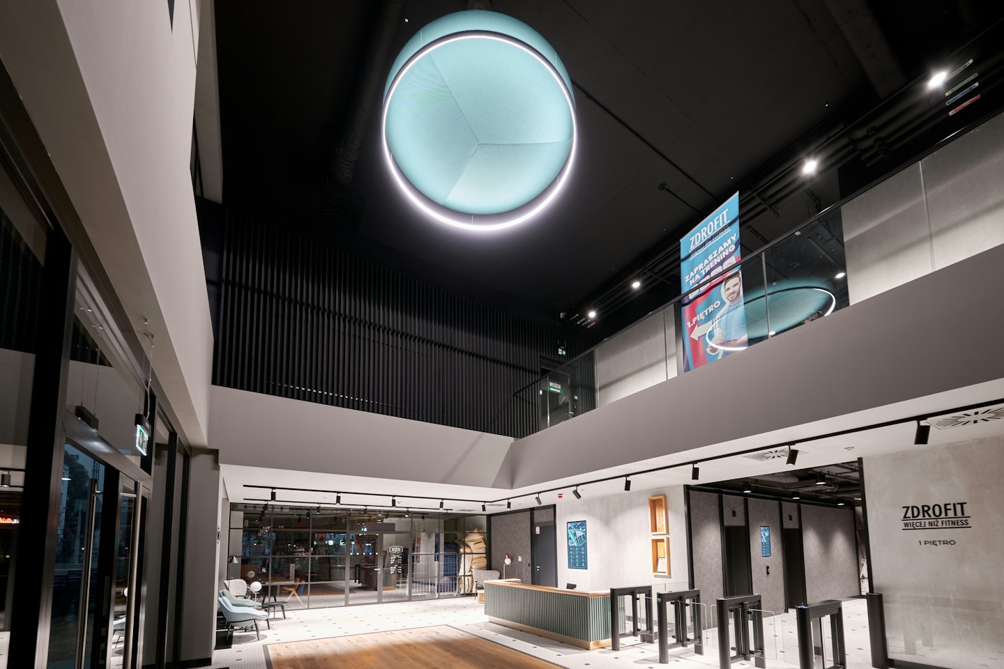 Reception and turnstiles in a modern office lobby.